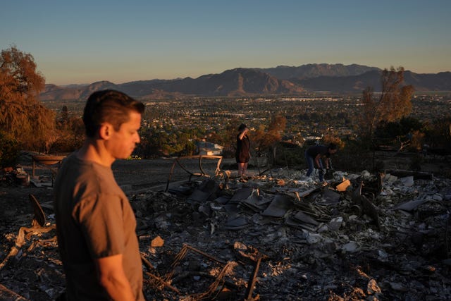 Man surveys fire damage