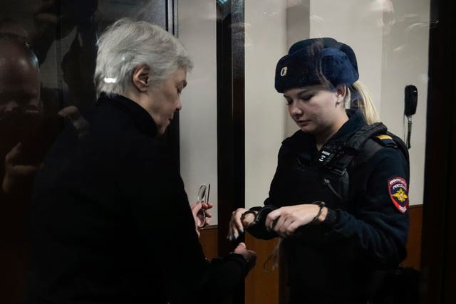 The defendant's handcuffs are removed in court