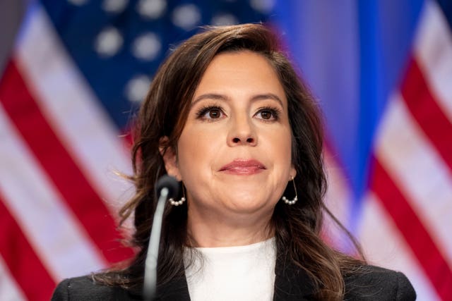 Elise Stefanik in front of the American flag