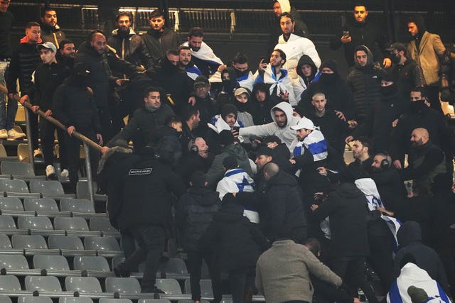 Fans clash in the stands during the Nations League match between France and Israel at the Stade de France