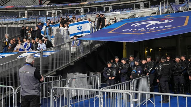 Police officers stand near the pitch ahead of the Nations League match between France and Israel in Paris 