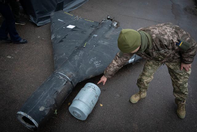 Soldier examines a drone