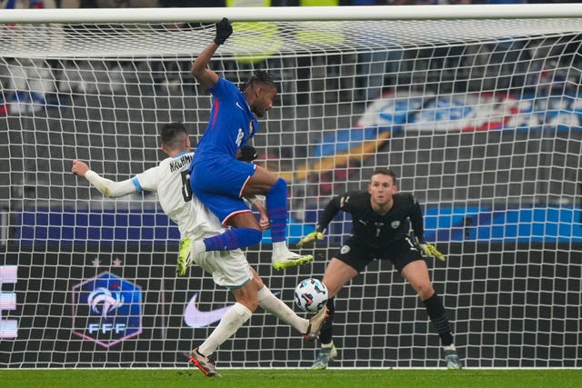 France’s Christopher Nkunku and Israel’s Idan Nachmias compete for the ball during a Nations League match