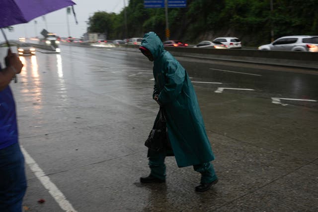 Someone battles against bad weather