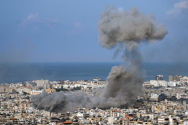 Smoke rises after an Israeli air strike on Dahiyeh