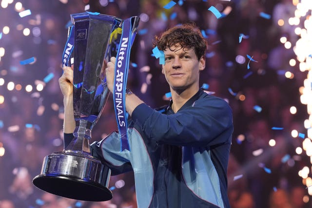 Jannik Sinner holds the ATP Finals trophy 