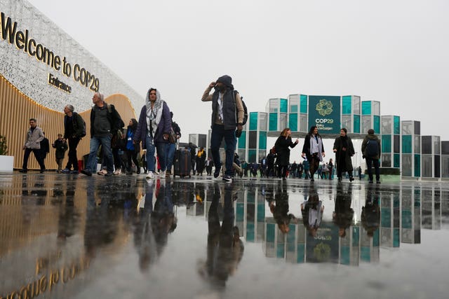 People arriving at the venue for Cop29 in Baku, Azerbaijan