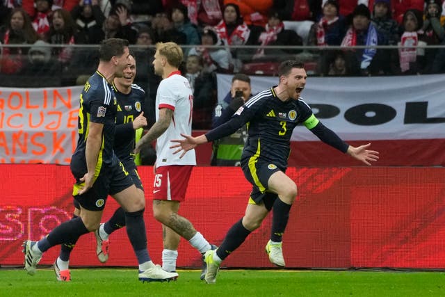 Scotland’s Andy Robertson (right) celebrates with his team-mates