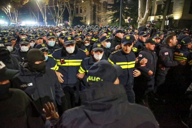 Police block a street during a rally in Tbilisi