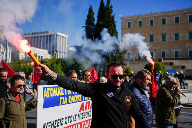 Striking workers in Greece let off flares