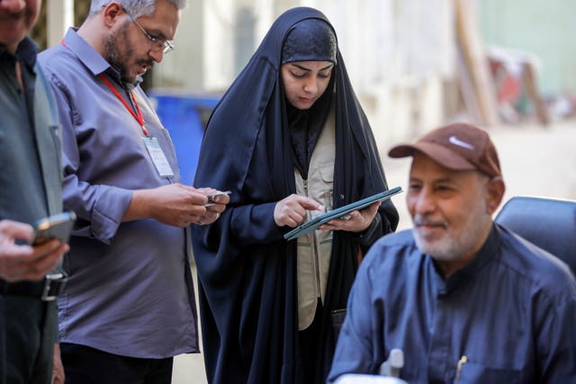 Workers prepare to collect information from the public 