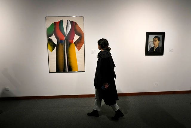 A woman visits an exhibition titled Eye to Eye which showcases over 120 works by modern world artists as well as Iranian painters at Tehran Museum of Contemporary Art