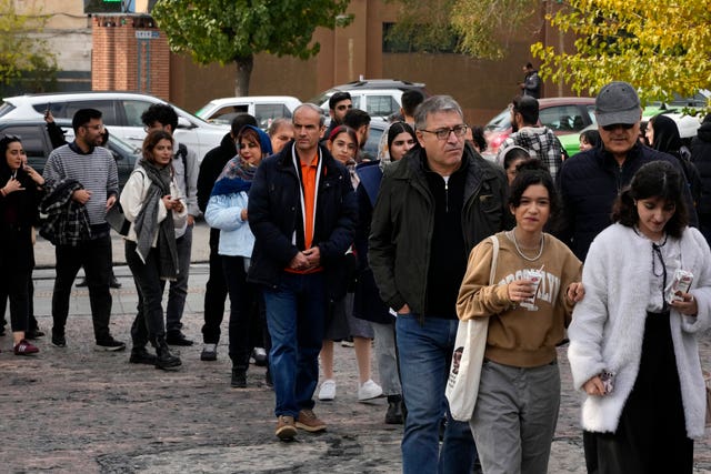 Iranians line up to visit an exhibition titled Eye to Eye 