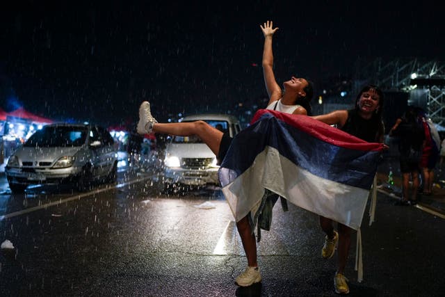 Supporters of the Frente Amplio (Broad Front) celebrate the victory of candidate Yamandú Orsi 