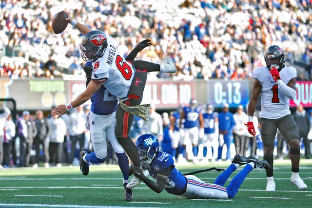 Baker Mayfield leaps to score a touchdown