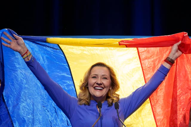 Elena Lasconi with a Romanian flag