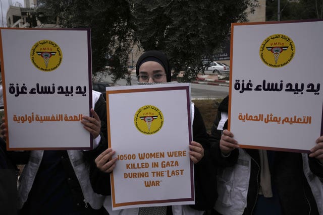 Members of the Palestinian Medical Relief Society mark the International Day for the Elimination of Violence Against Women in Bethlehem