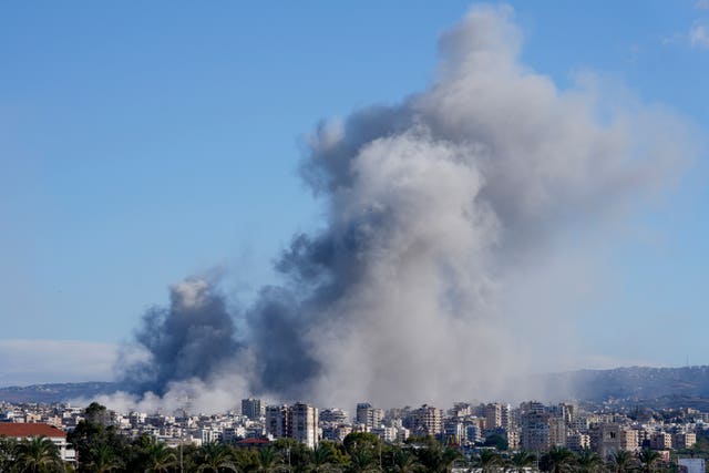 Smoke rises between buildings hit in Israeli airstrikes in Hosh neighbourhood, in Tyre