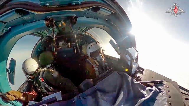 Pilots of an Su-34 bomber of the Russian air force fly at an undisclosed location in Ukraine