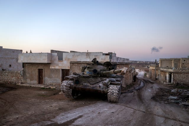 A destroyed Syrian army tank in the village of Anjara