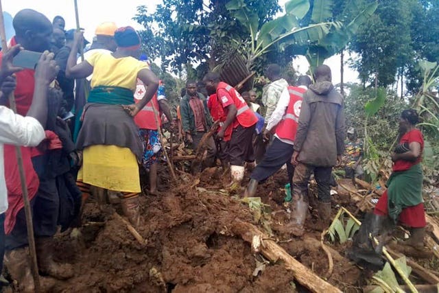 Rescuers search for bodies after a landslide