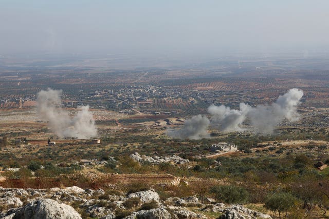 Smoke rises amid fighting between opposition factions and Syrian government troops