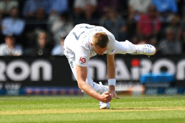 England’s Gus Atkinson takes a catch off his own bowling to dismiss New Zealand’s Devon Conway 