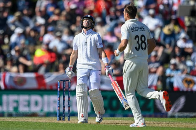 England’s Ollie Pope reacts after he was dismissed by New Zealand’s Tim Southee, right