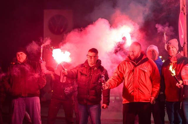 Volkswagen workers light up flares