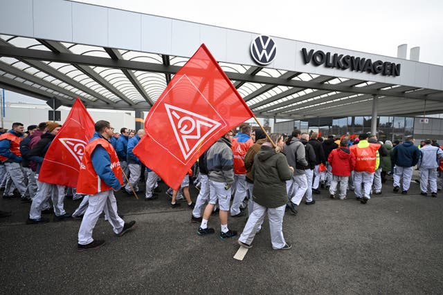 Volkswagen workers with flags