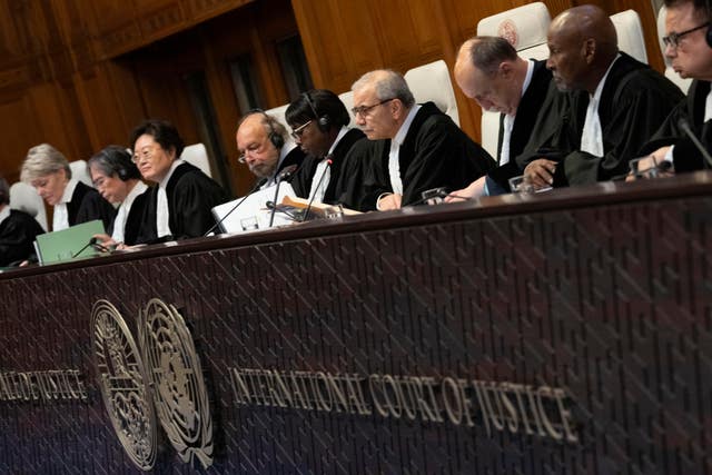 Presiding Judge Nawaf Salam, fourth from right, opens hearings