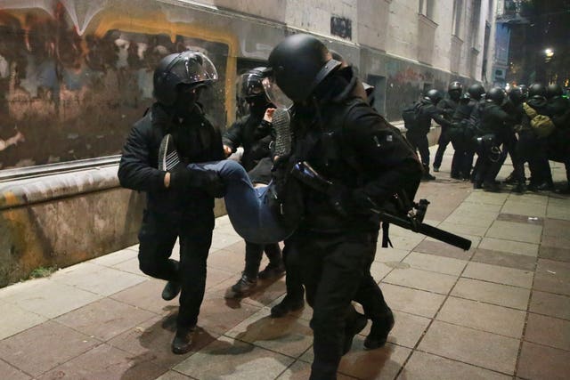 Police detain a demonstrator in Tbilisi 