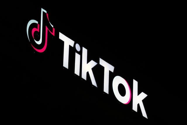 TikTok sign illuminated on a building