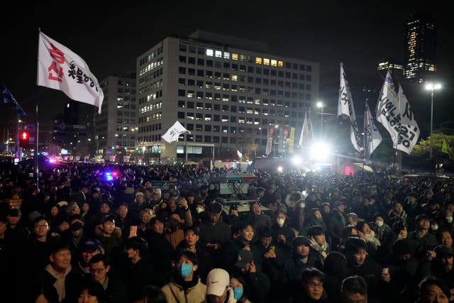 People gather in front of the National Assembly in Seoul, South Korea