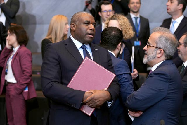 David Lammy with a folder of documents in his hand