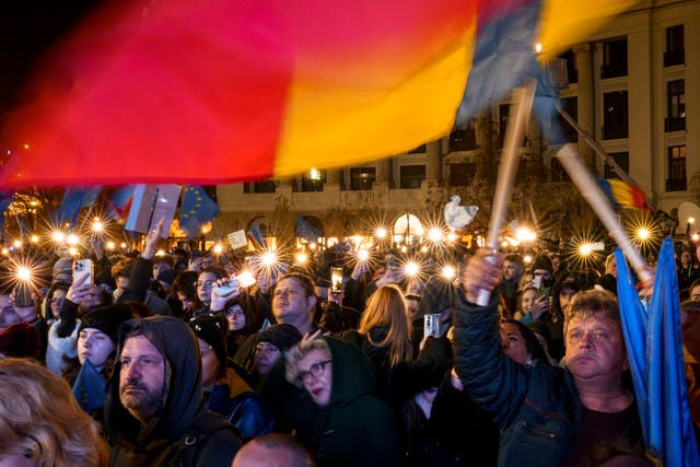 Bucharest rally with a Romanian flag prominent