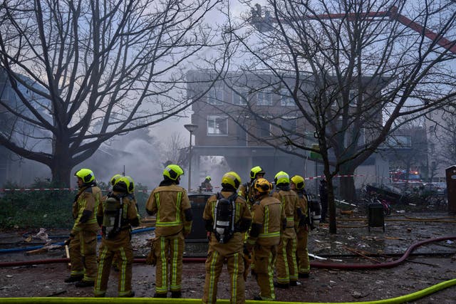 Firefighters work at the scene