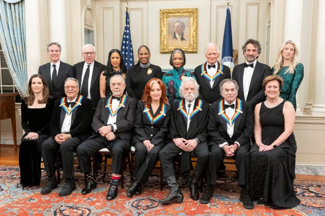 Front row from left, Evan Ryan, Arturo Sandoval, Francis Ford Coppola, Bonnie Raitt, Bobby Weir, Mickey Hart, Deborah F. Rutter; second row from left, Secretary of State Antony Blinken, David M. Rubenstein, Michelle Ebanks, Kamilah Forbes, Jonelle Procope, Billy Kreutzmann David Jammy, and Liz Kelly pose for a group photo of the 2024 Kennedy Centre Honourees at the State Department