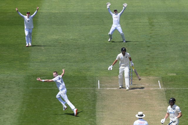 England’s Gus Atkinson, bottom left, celebrates after trapping New Zealand's Tim Southee lbw to complete his hat-trick