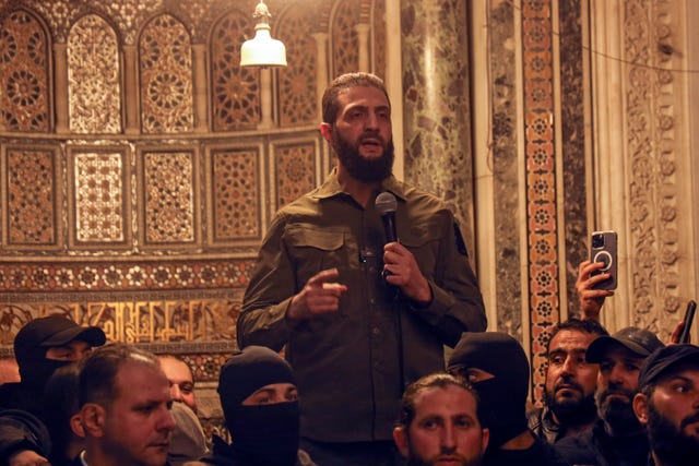 Abu Mohammed al-Golani speaks at a mosque in Damascus