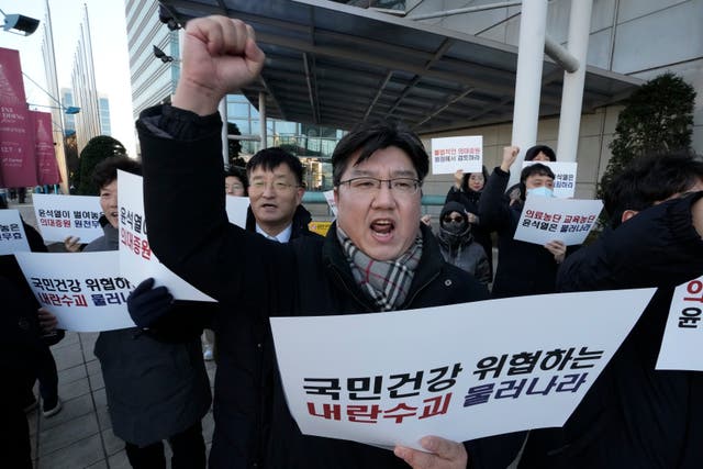 Members of Emergency Committee of Medical School Professors Nationwide shout slogans during a rally demanding the resignation of South Korean President Yoon Suk Yeol