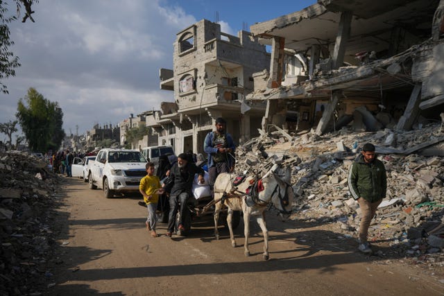 Palestinians with a donkey carrying UN-donated flour in Khan Younis