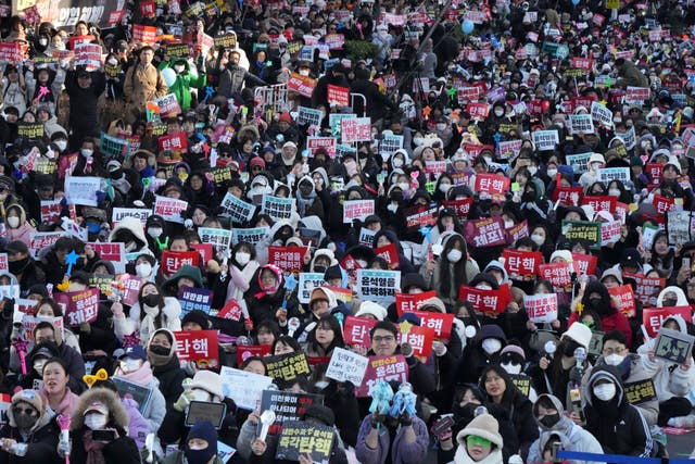 People shout slogans during a rally to demand South Korean President Yoon Suk Yeol’s impeachment 