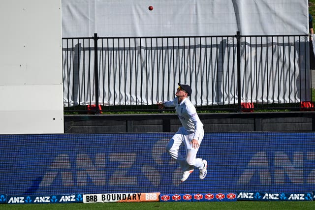 Harry Brook throws the ball back over the boundary rope to take a catch