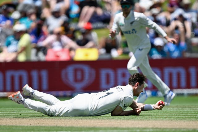 Matt Henry takes a catch off his own bowling to dismiss Zak Crawley