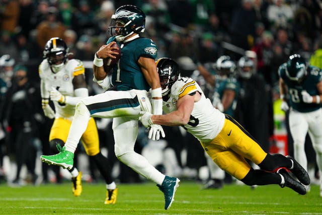 Philadelphia Eagles quarterback Jalen Hurts is tackled by Pittsburgh Steelers linebacker TJ Watt 