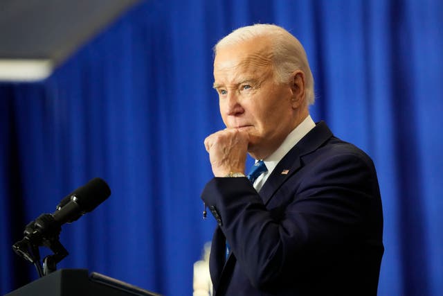 Joe Biden with his hand on his chin