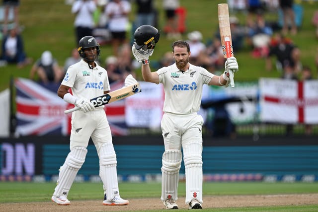 New Zealand’s Kane Williamson raises his bat after reaching his century