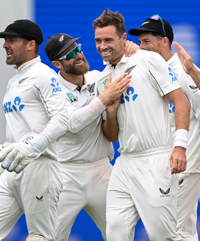 New Zealand bowler Tim Southee is congratulated by teammates after taking the wicket of England’s Jacob Bethell