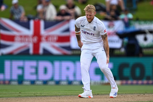 England captain Ben Stokes grabs at his leg